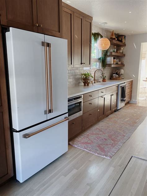 white appliances with brown cabinets